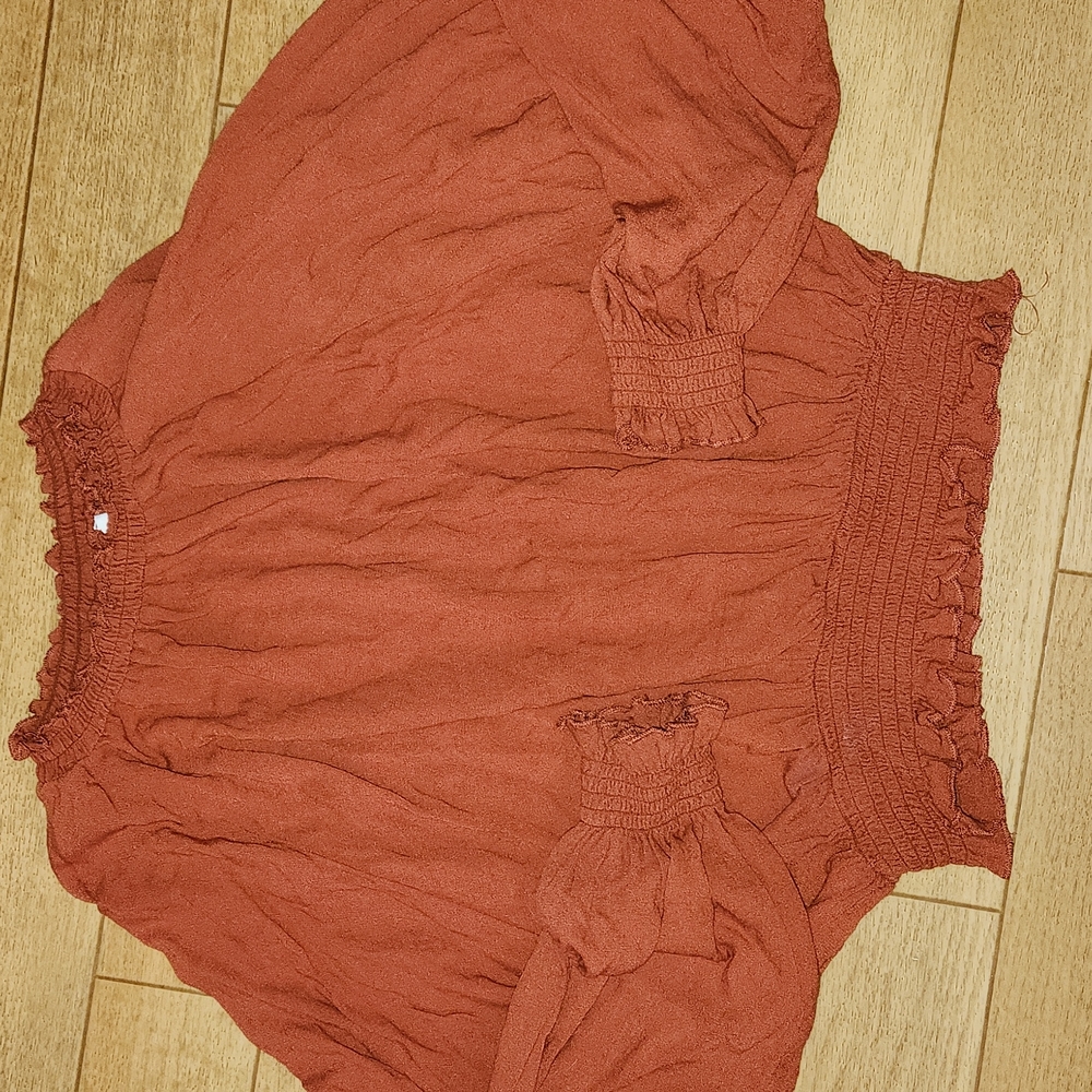 Womens burnt orange shirt.